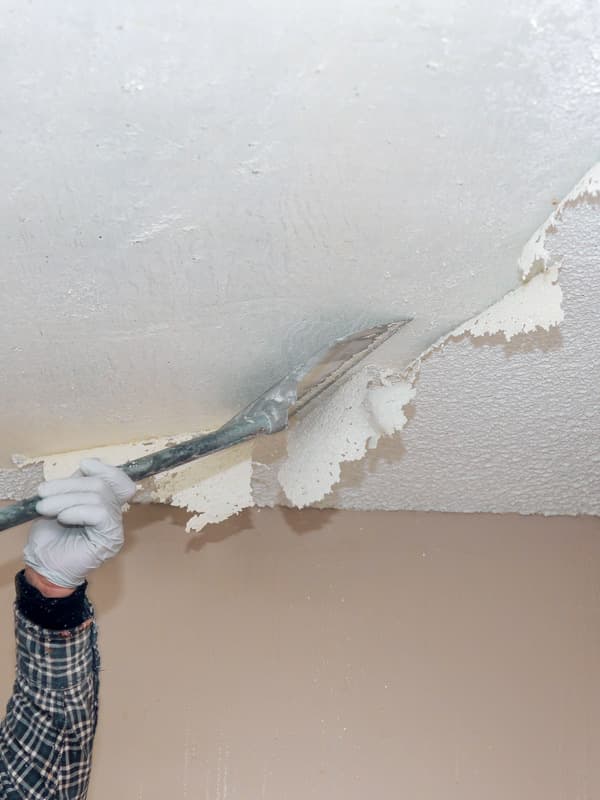 Wet scraping popcorn ceiling texture